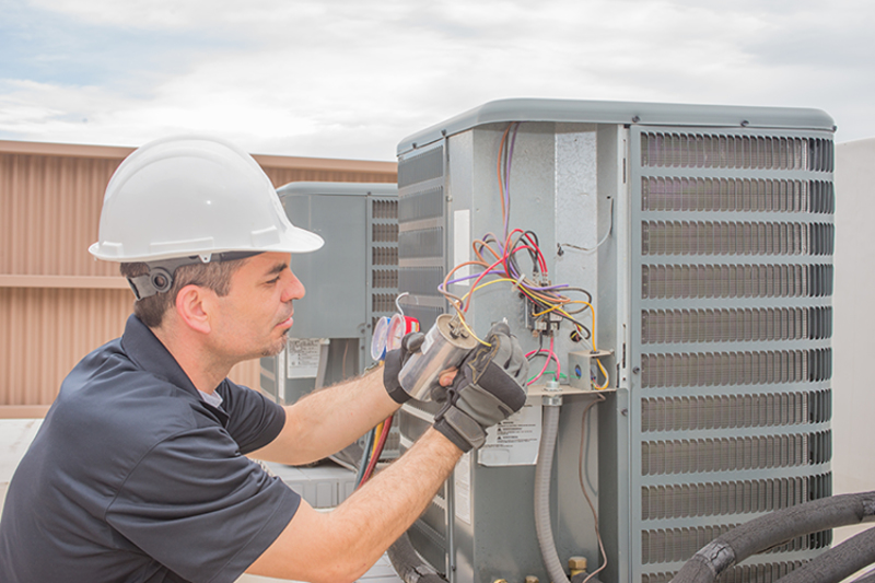 JD's HVAC technician performing new system installation in Central Indiana